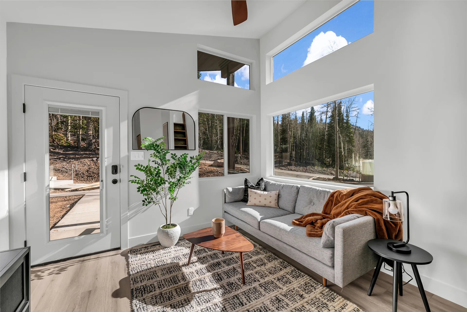 Living room, full kitchen and dining space in the shared Unplug cabin layout